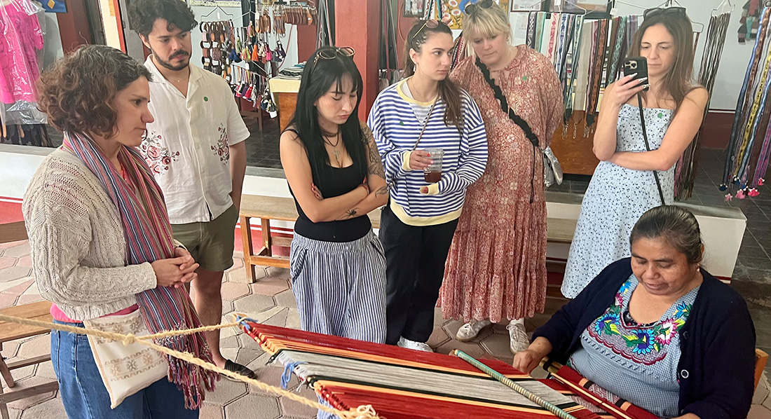 students visiting a family textile company for a Mexico seminar
