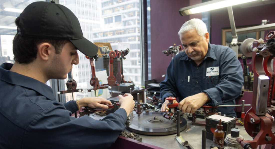 Matthew Denatale ’25 learns from master diamond cutter Willie Lopez, who has 54 years of experience. The wheel is embedded with diamond fragments, making it possible to cut and polish diamonds.