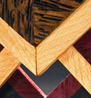 Heather Kosch - Harmonic Collection - Black-palm, ebony, purple-heart, and satin woods; brass findings; and leather cording.<br />
