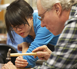 Student in metal casting class. 