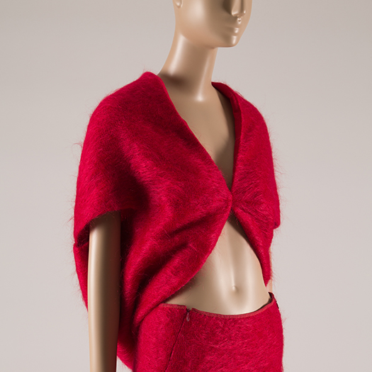 red mohair crop top and matching skirt on a mannequin
