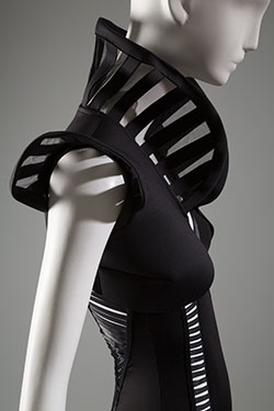 black bodysuit with rib-like cut-out design at front