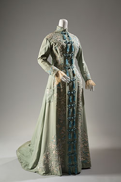 light green morning robe with  symmetrical floral embroidery in shades of blue and white; "Chinese" styling with stand collar and multiple tassels and CF frogs