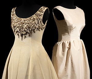 two cream colored evening gowns by Dior and Balenciaga, left to right