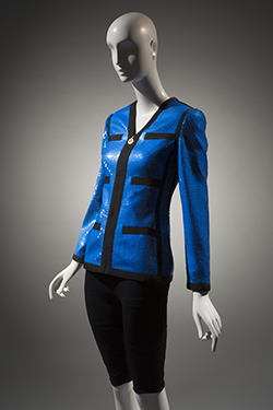 royal blue sequin evening jacket with black grosgrain trim, form fitting, collarless, v neckline, and CF logo zipper closure