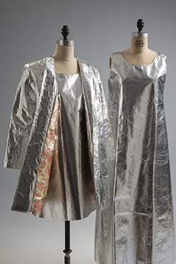 3/4 length coat in silver laminated fabric with a round neck cardigan styling and a one-piece sleeve