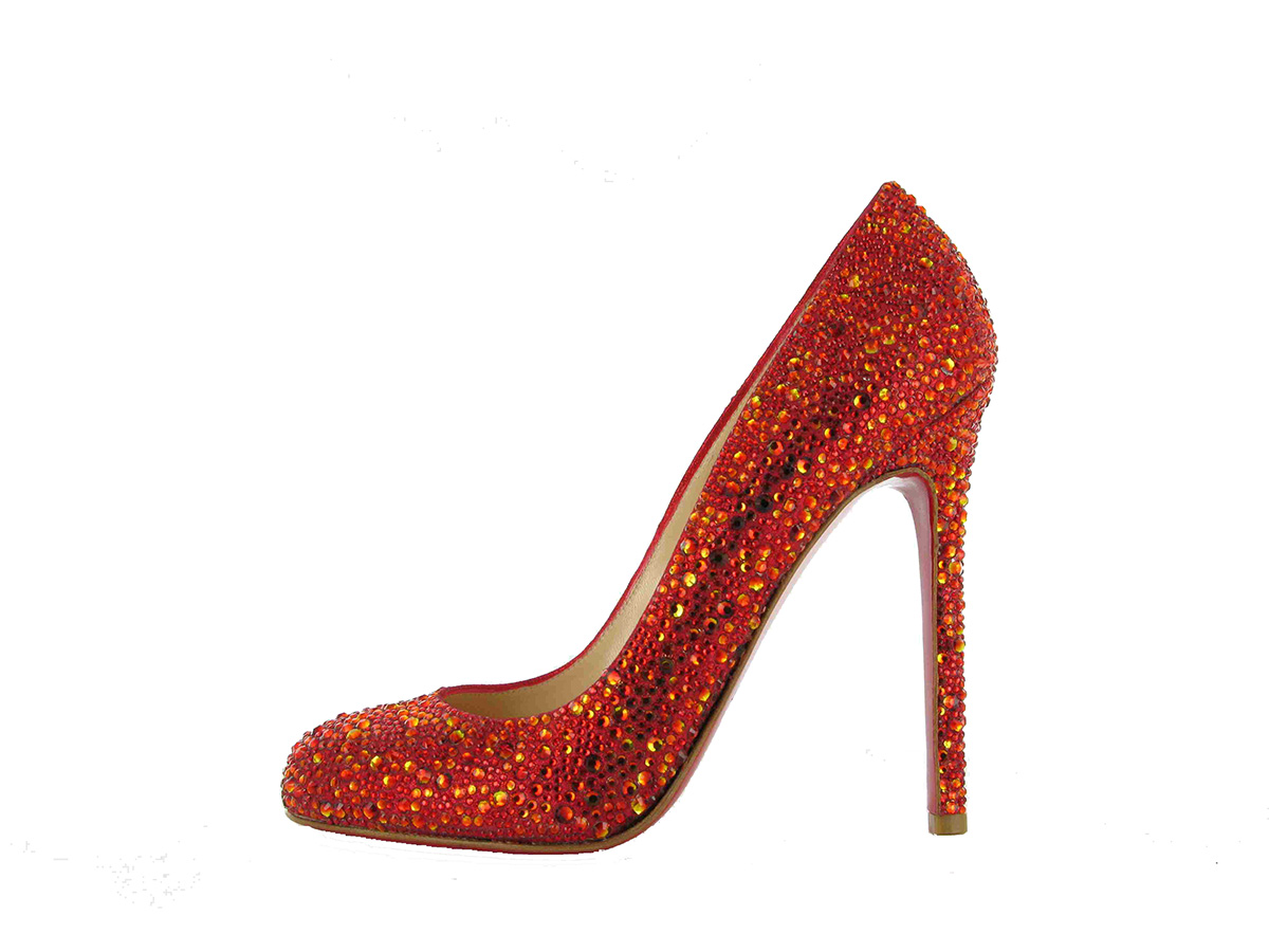 red high heeled shoe with red and gold crystals all over