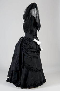 Victorian Mourning Dress, c. 1880, black silk and netting. Lent by Evan Michelson. Photo by Irving Solero.