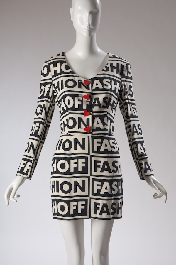 mannequin wearing black and white graphic dress with text printed on it