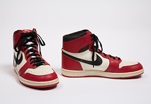 red and white high top sneakers with black nike swoosh