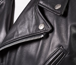 detail of black leather motorcycle jacket