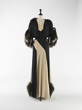 Nina Ricci, evening ensemble (dress and bolero),             wool and silk muslin in cream and black, ostrich feathers, circa 1937. © Julien Vidal/Galliera/Roger-Viollet.