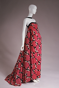 red, black, and white Strapless evening dress with long rectangular stole.