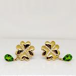 Gold and diamond earrings with chromium diopside drops
