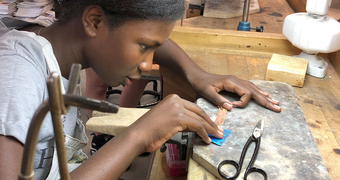 student at a sewing machine