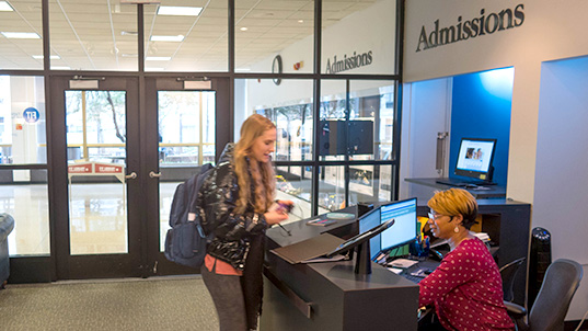 student at FIT Admissions office