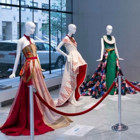 three evening gowns on mannequins