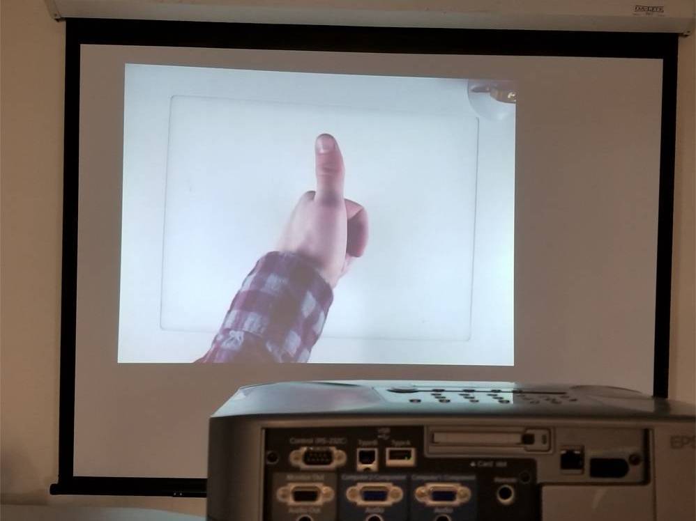 Image of ELMO projection thumbs up