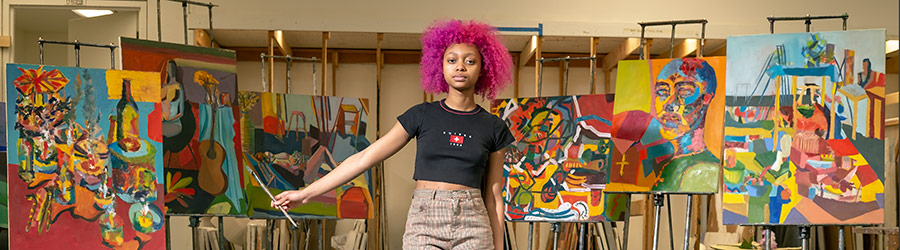 photo of artist with artwork