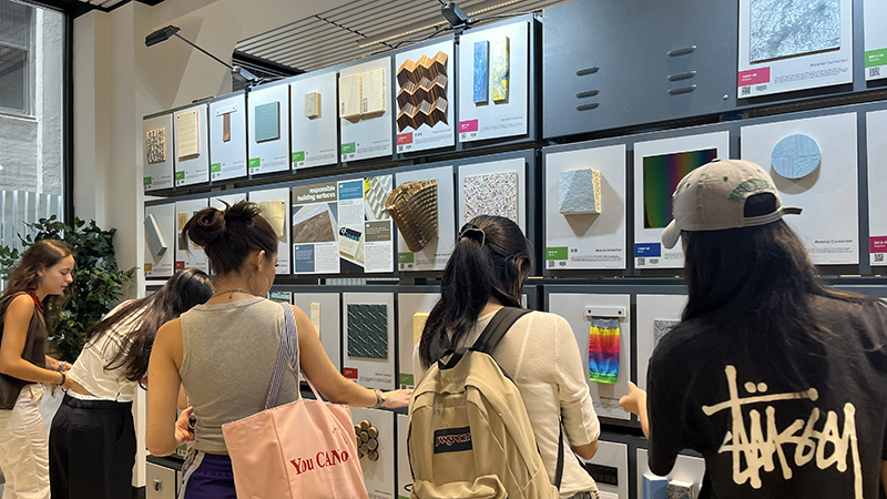 students looking at a wall of various textures and materials