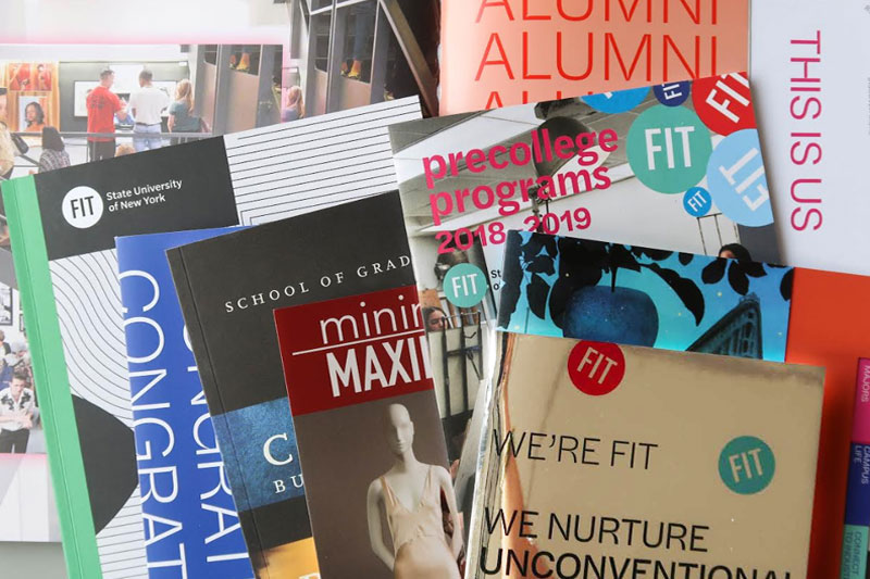 A collection of print catalogs and brochures from FIT