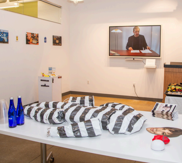 an empty black and white striped garment laid out on a table