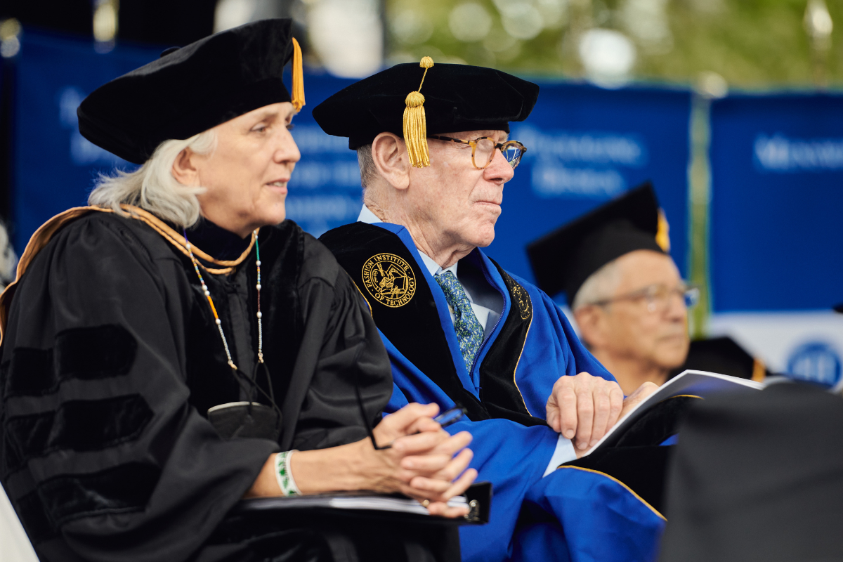 faculty members sitting in regalia