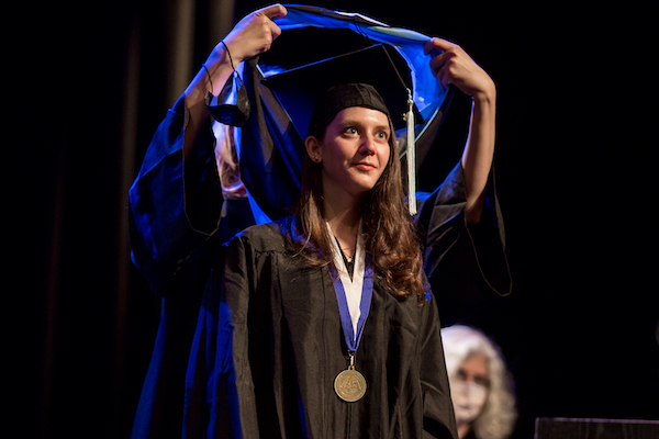 Graduate study abroad concept : Graduation cap on calendar paper