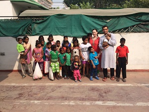 Courtney and son Vikramaditya with some of the girls in One Life to Love primary school