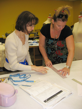 tutor working with fashion design student