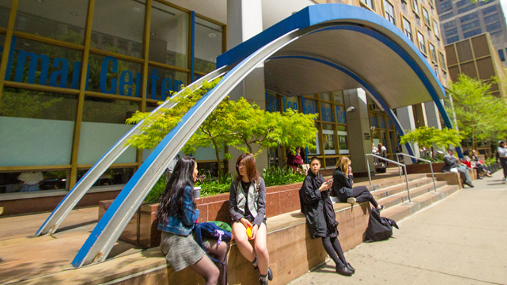 students sitting outside the feldman center