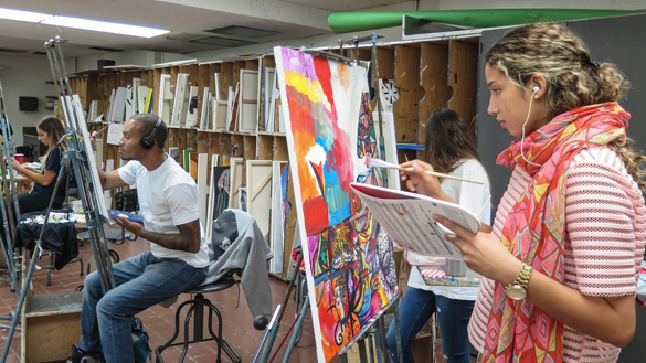 students painting in class