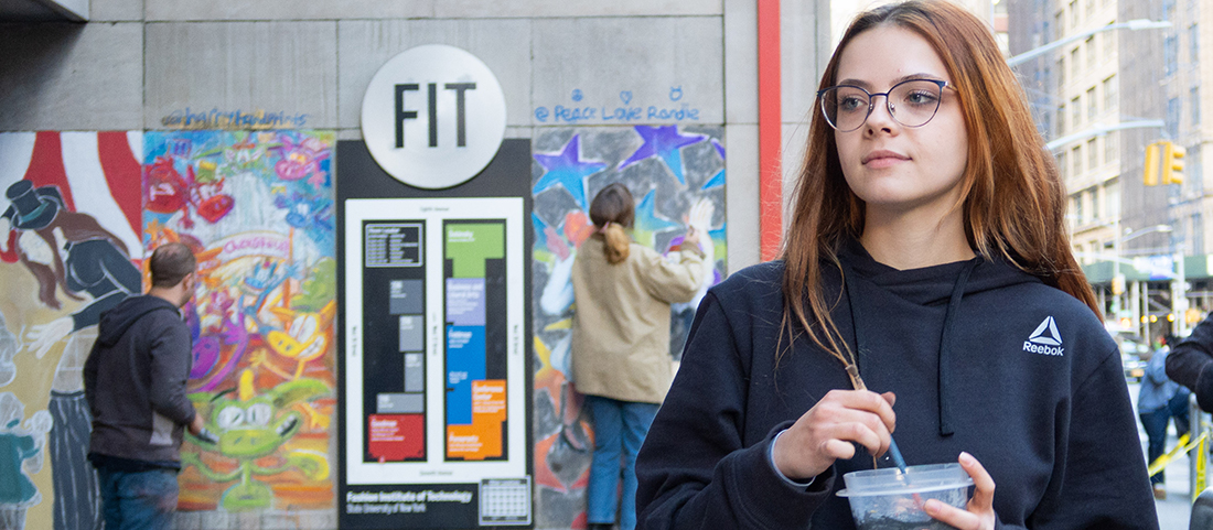 FIT student in front of ChalkFIT project outdoors