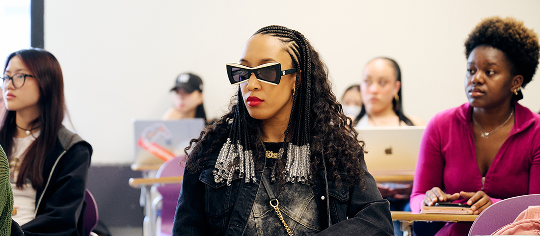 FIT student with cool sunglasses in class