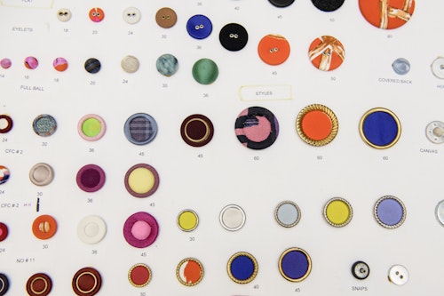 A photo of buttons in different sizes and colors
