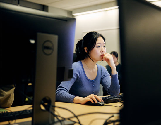 Female student sitting at a computer 