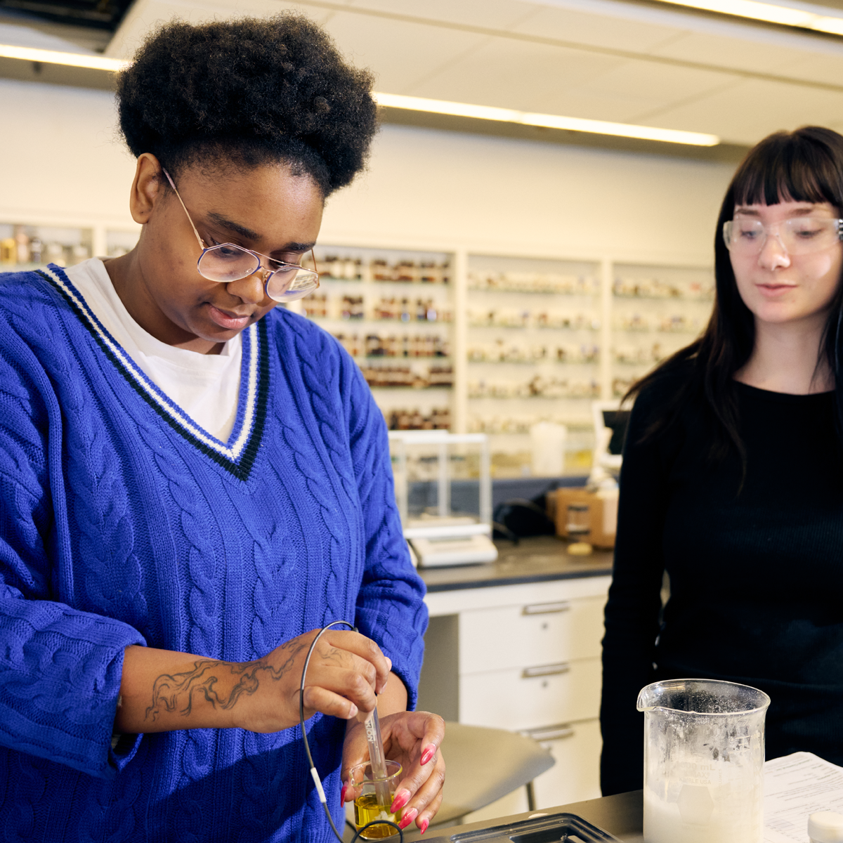 FIT students mixing ingrediends in Cosmetic and Fragrance Marketing class