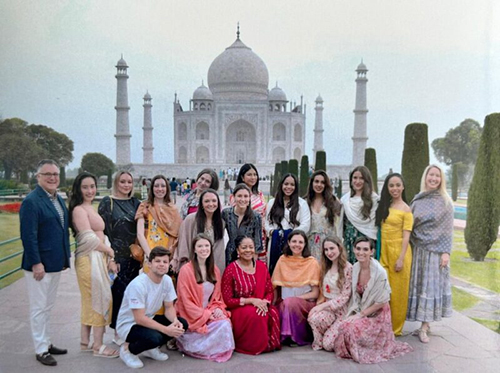 a group of FIT CFMM student visiting India and posed in front of the Taj Majal