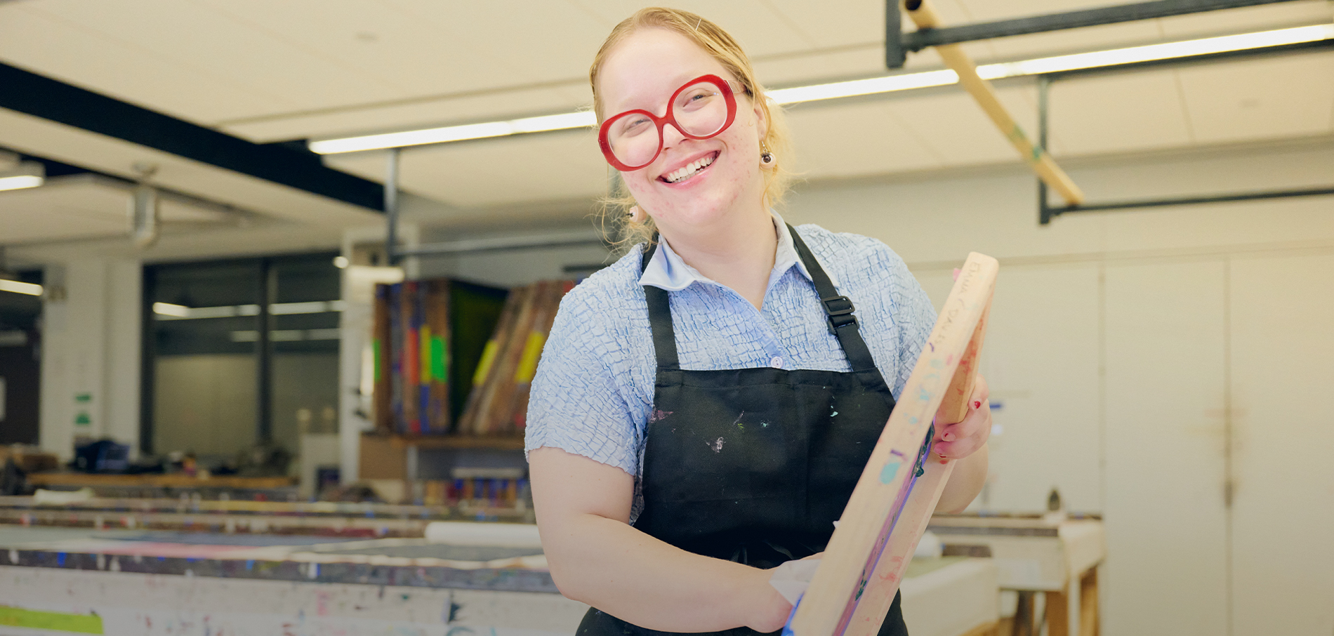 FIT student smile in screenprinting lab