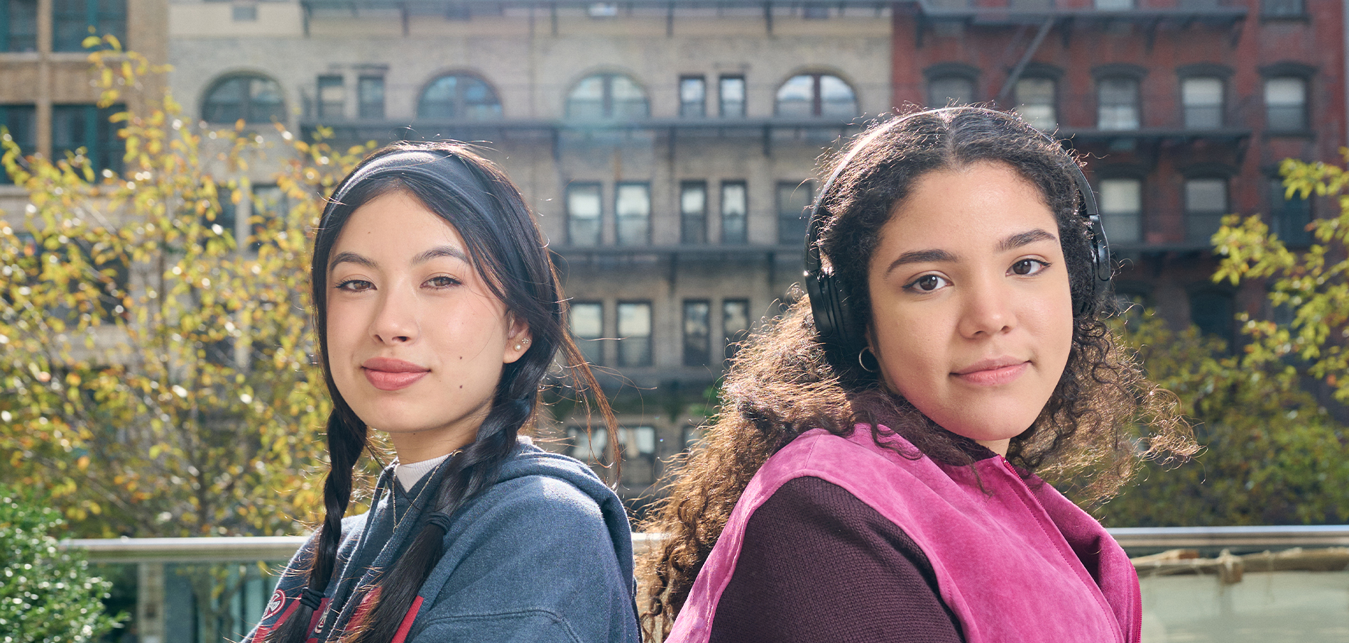 Two students sitting outdoors at FIT