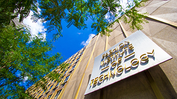 exterior image of FIT sign against blue sky