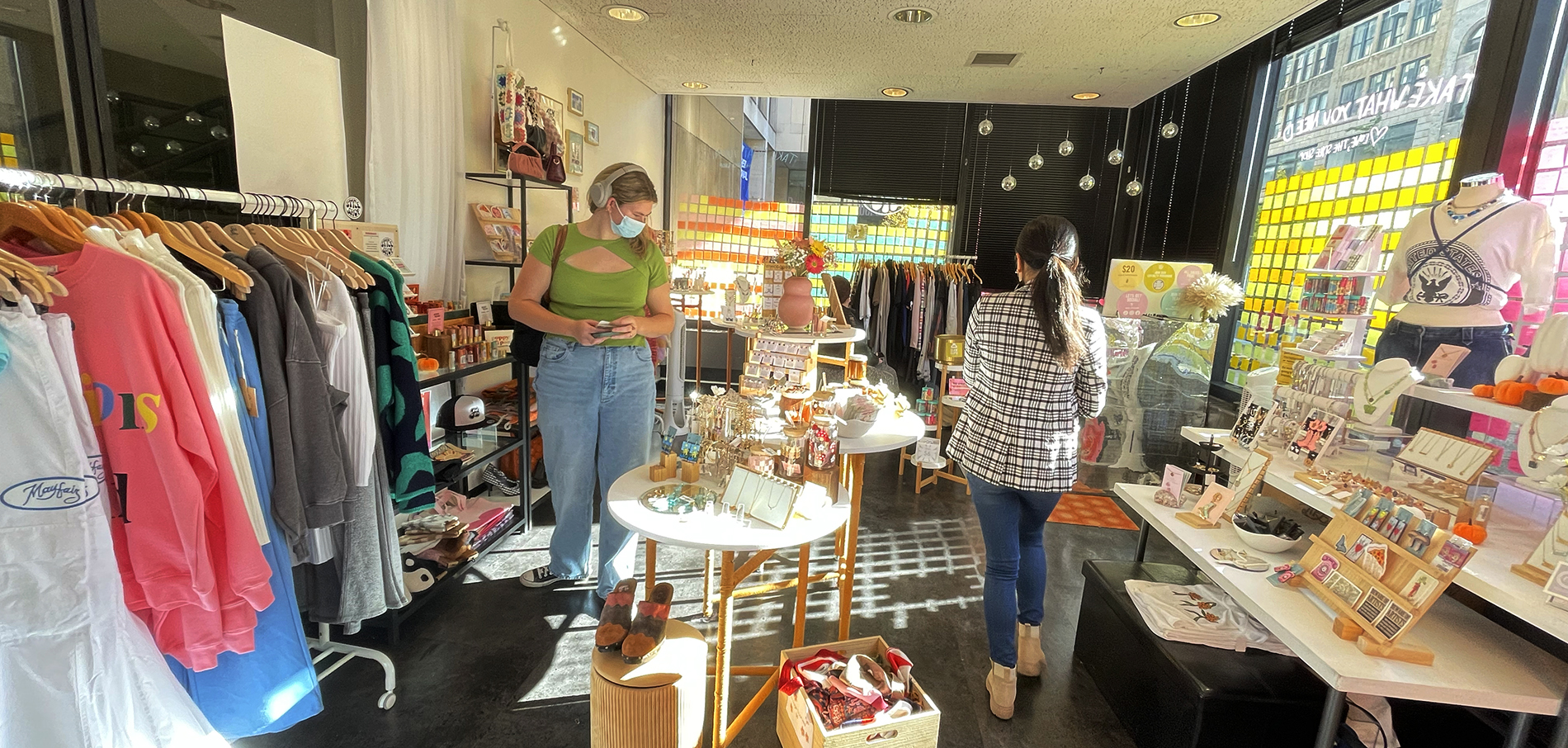 students looking at merchandise at the FIT style shop