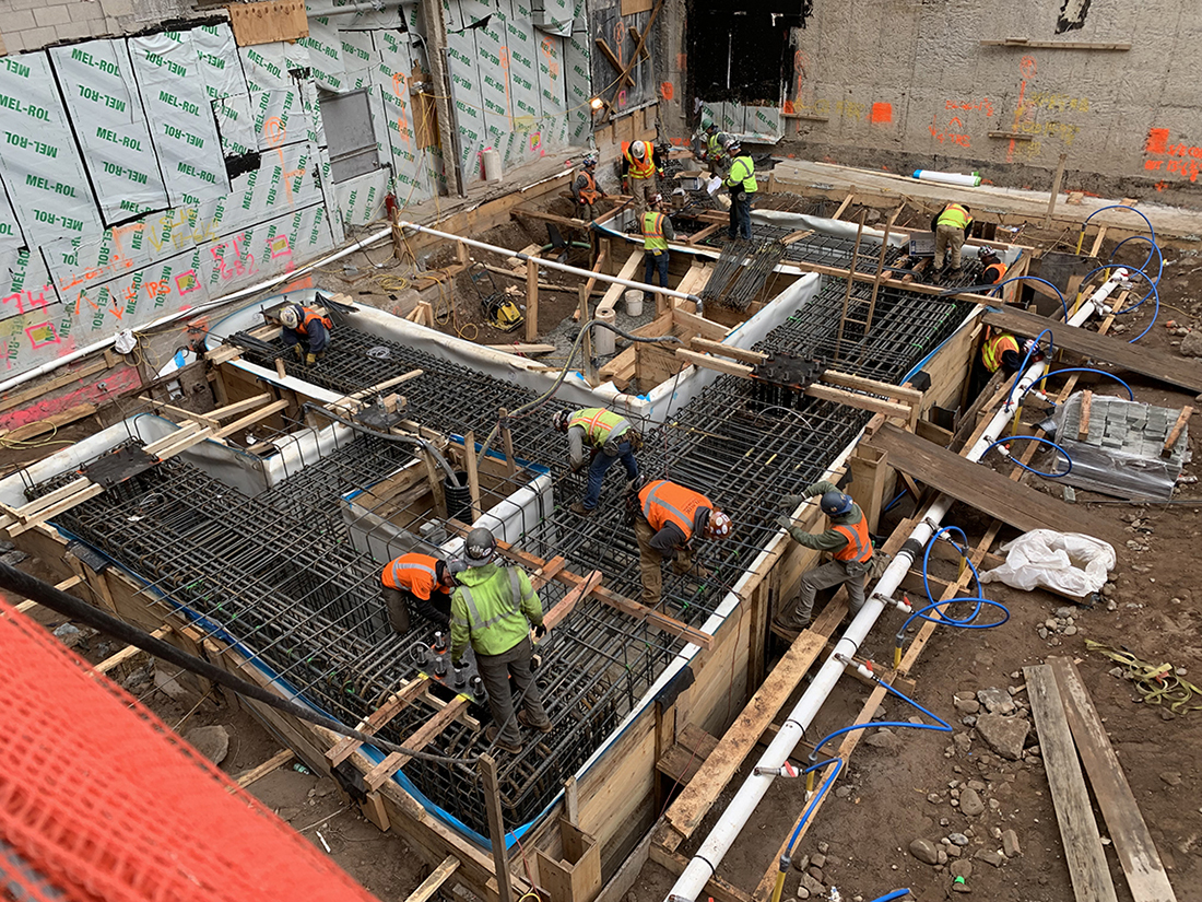 constrction workers laying rebar