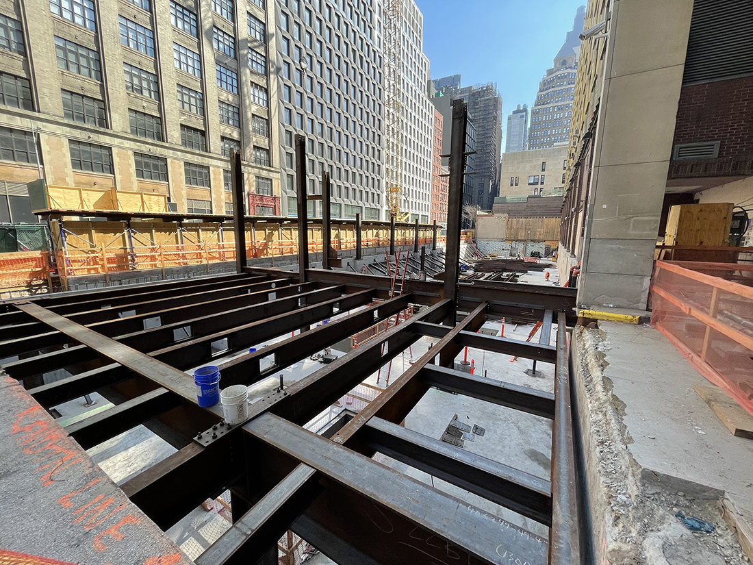 metal building beams being assembled