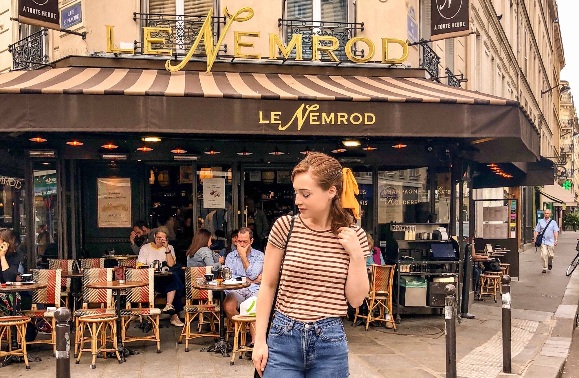 student enjoys vibrant Paris cafe