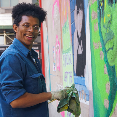FIT Illustration student painting on campus walls in New York City