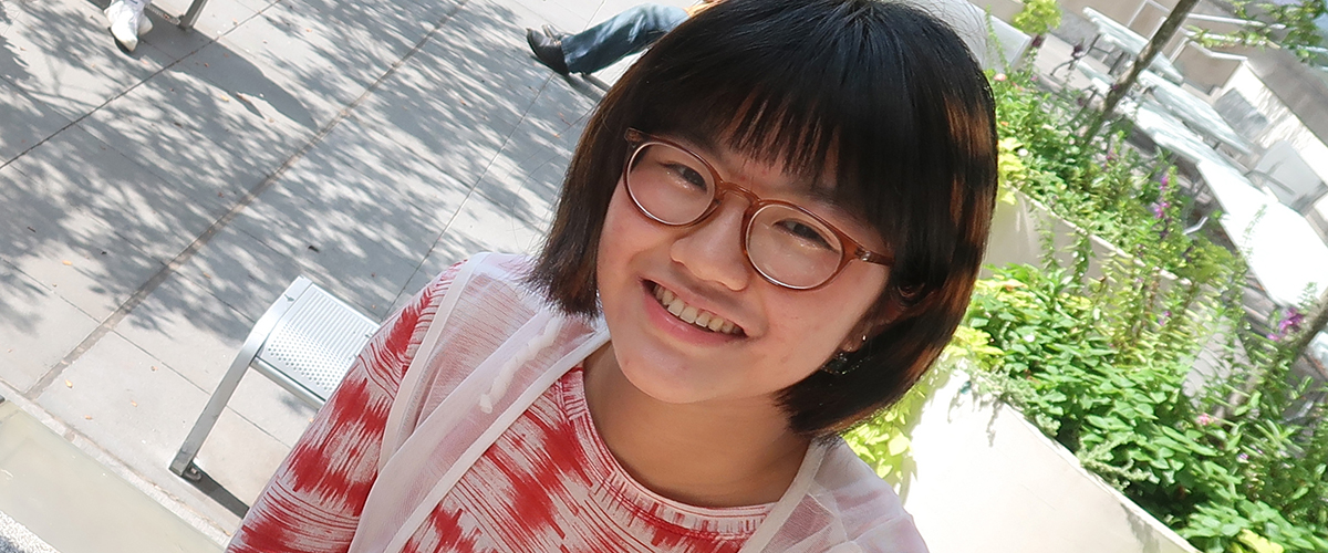 smiling FIT student outdoors on campus