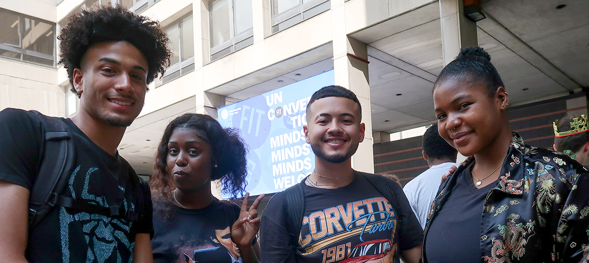 diverse students at FIT standing outside on campus