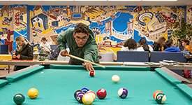 student playing pool at FIT