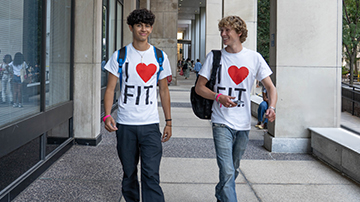 students walking through FIT breezeway